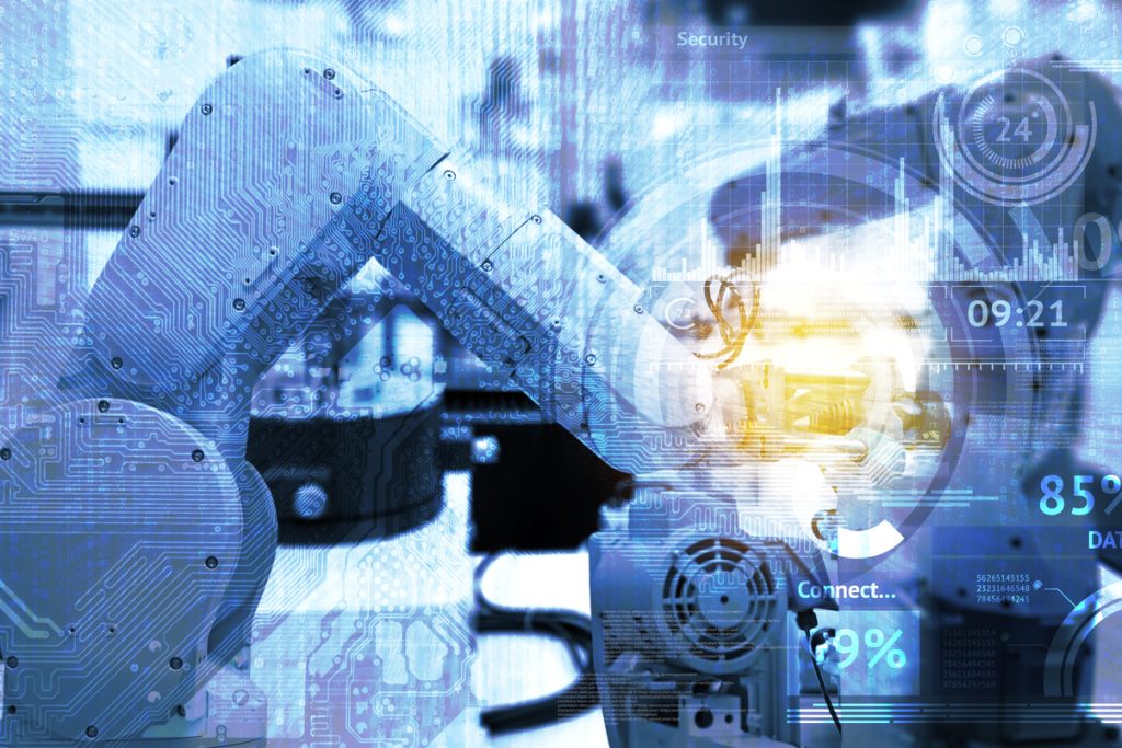 Industrial internet of things and industry 4.0 concept. Abstract blue background of technology graphic and automation wireless control robotic machine in smart factory with flare light effect.