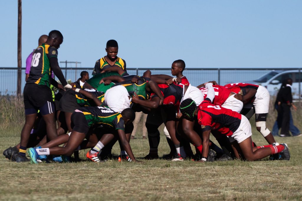 Rugby players engaged in a scrum during an outdoor match, showcasing teamwork and sportsmanship. — Sportsbetting Ireland offe