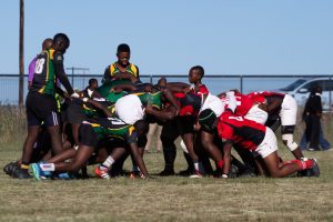 Rugby players engaged in a scrum during an outdoor match, showcasing teamwork and sportsmanship. — Sportsbetting Ireland offe